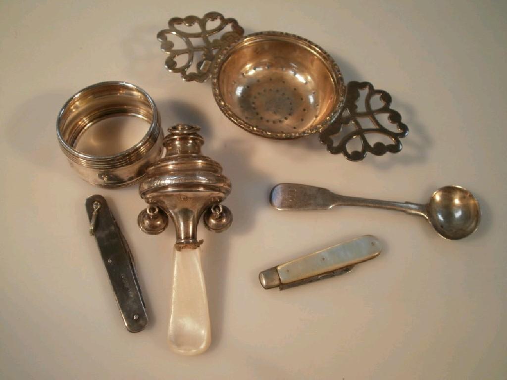 Appraisal: A Victorian silver child's rattle napkin ring pen knife mustard