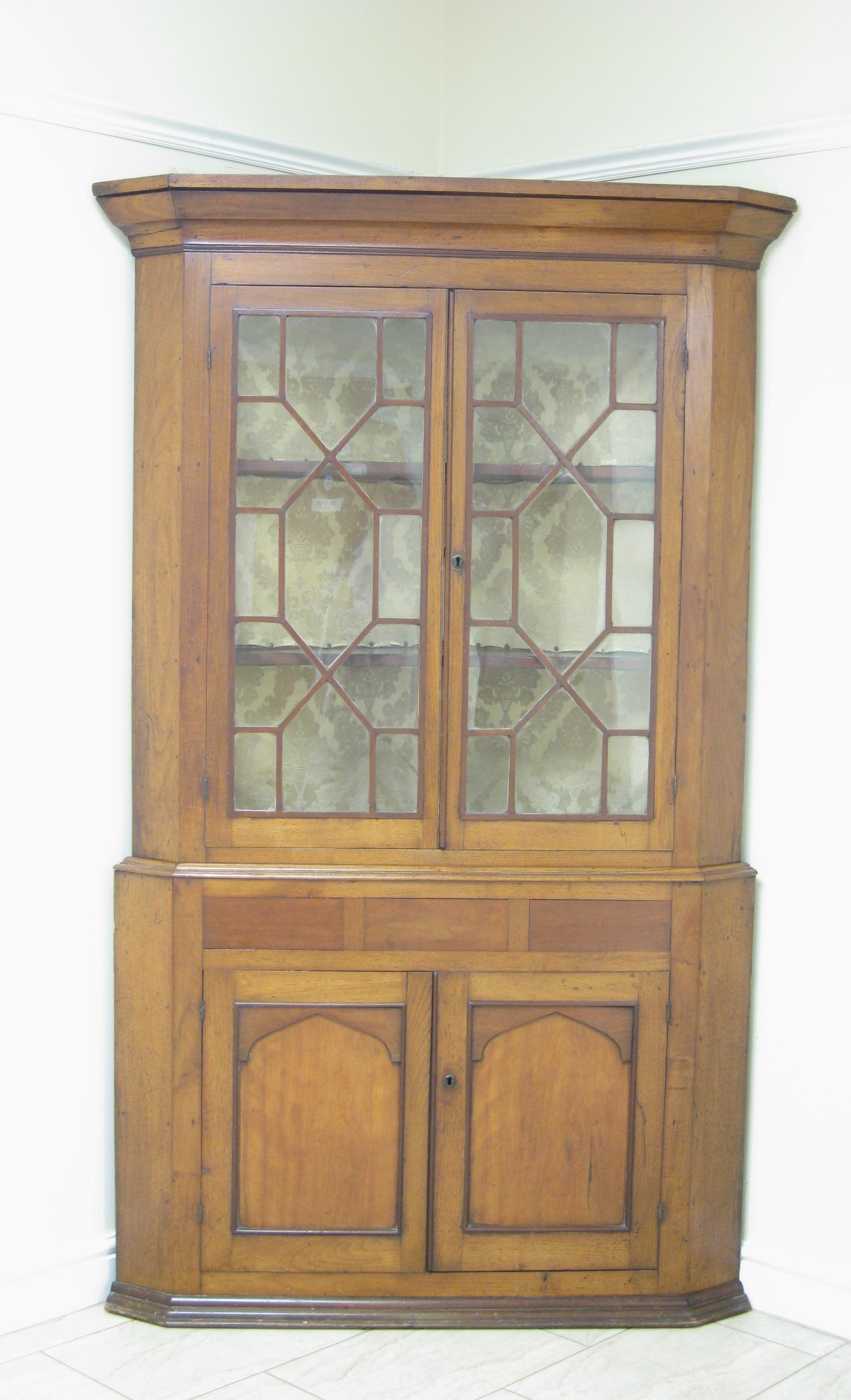 Appraisal: A th Century double Corner Cupboard the upper section fitted