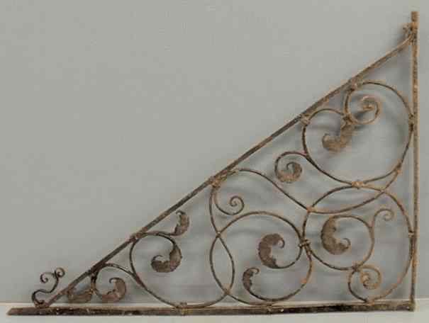 Appraisal: Large wrought iron bracket arm late th c with leafy