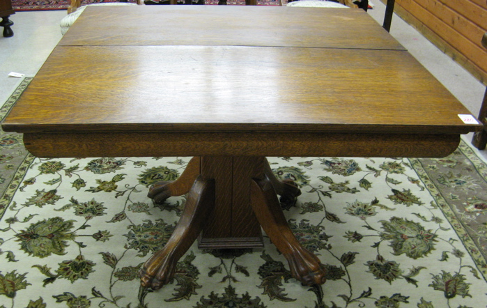 Appraisal: SQUARE OAK DINING TABLE American c The table's square oak