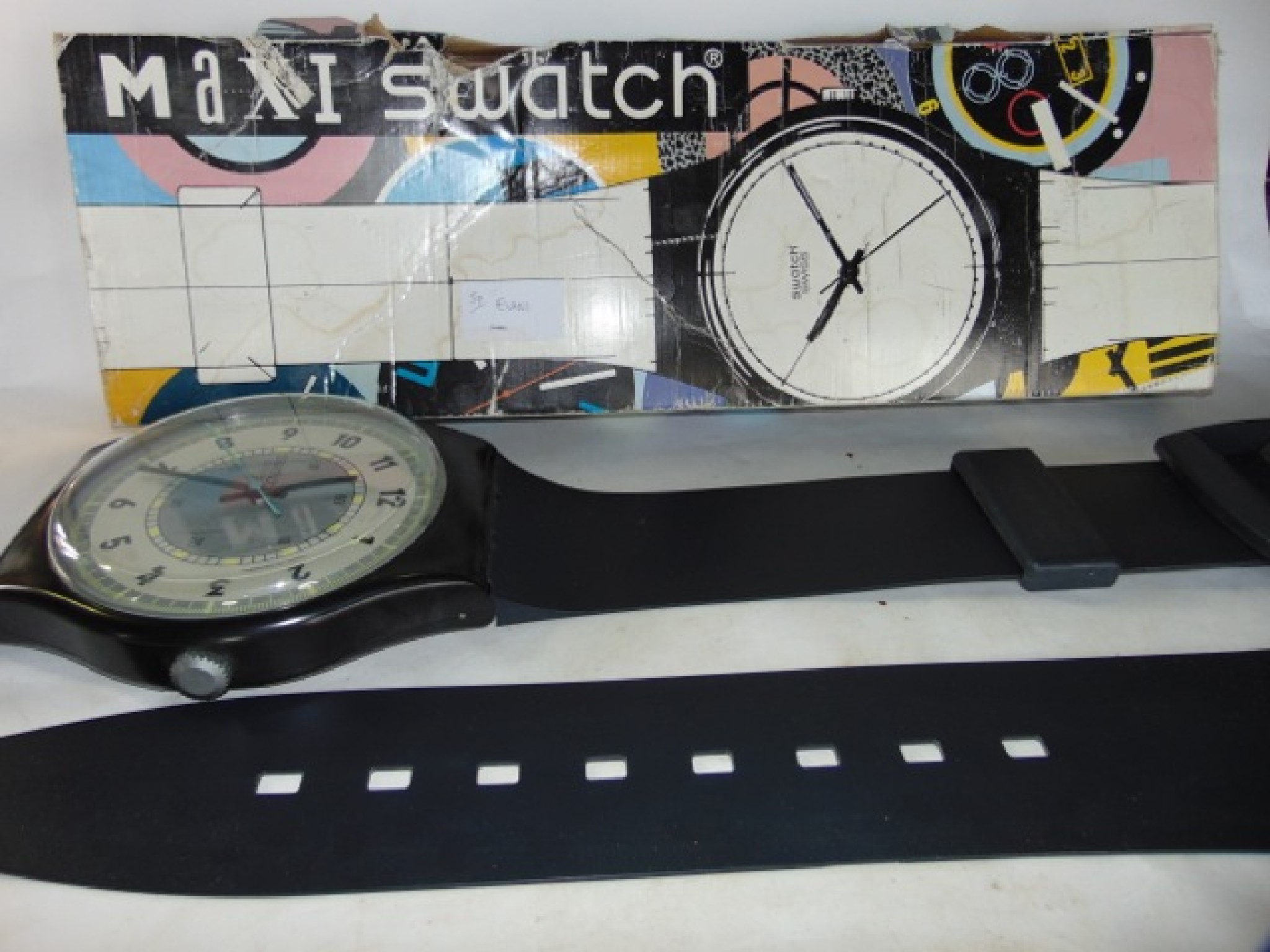 Appraisal: A Swatch Maxi wall clock in the form of an