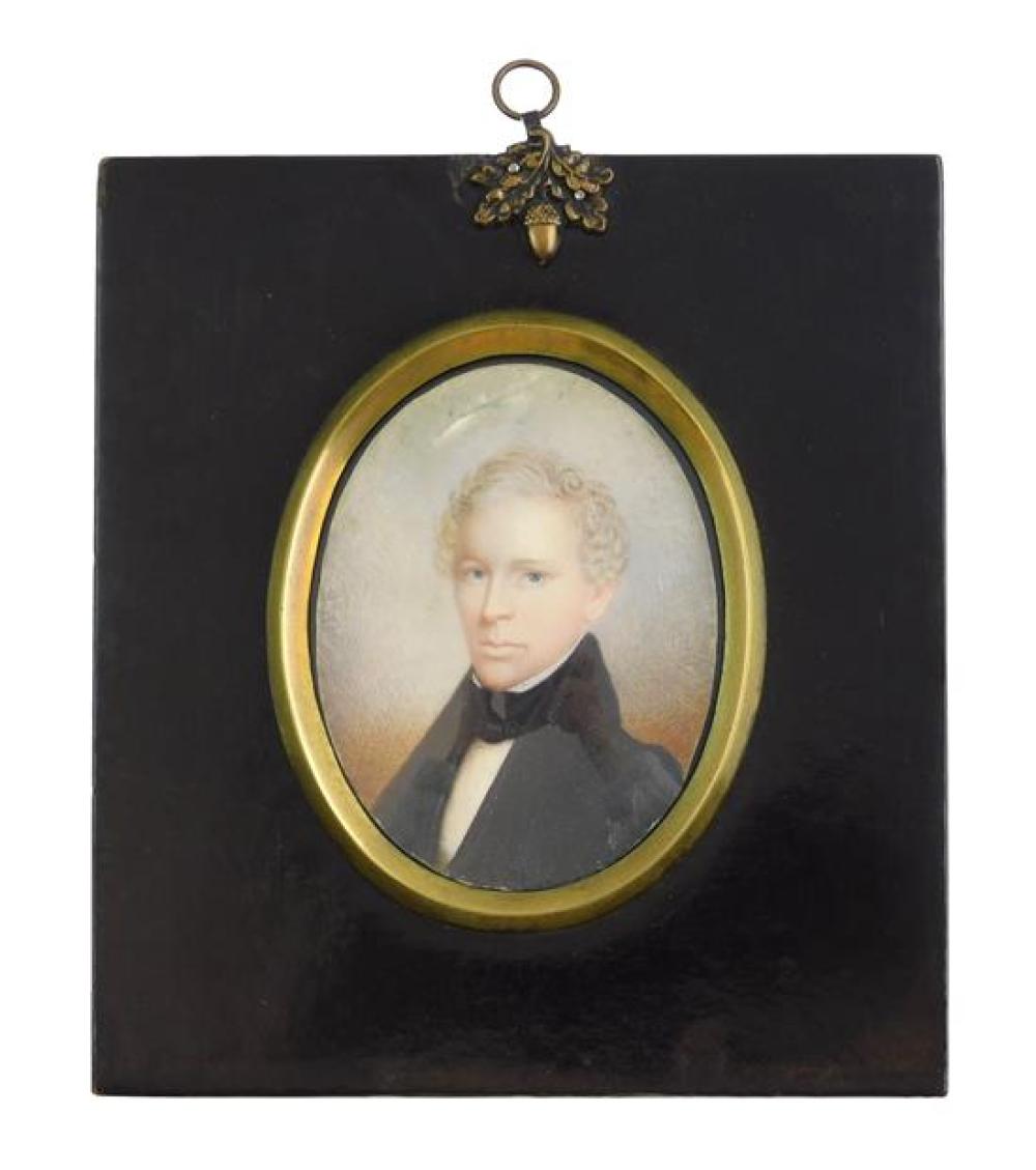 Appraisal: MINIATURE Young man oval support wearing black jacket and necktie