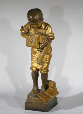 Appraisal: A Goldscheider figure of a school boy cast from a