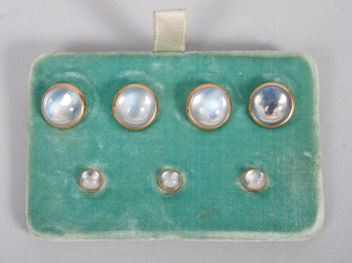 Appraisal: K gold and cabochon moonstone -piece stud set in a