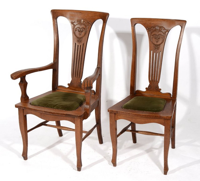 Appraisal: A SET OF EIGHT EDWARDIAN OAK DINING CHAIRS each with