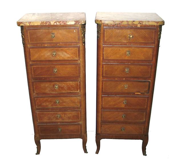 Appraisal: A pair of Louis XVI style walnut semainiers with marble