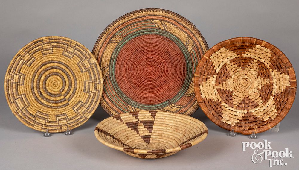 Appraisal: Four coiled tribal baskets Four coiled tribal baskets largest -