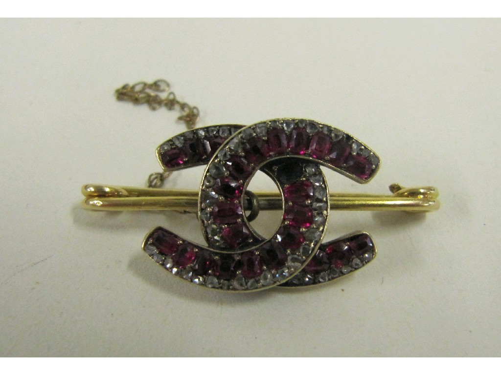 Appraisal: Victorian gold ruby and diamond set horseshoe bar brooch one