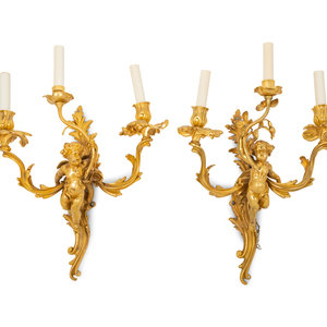 Appraisal: A Pair of Louis XV Style Gilt Bronze Figural Three-Light