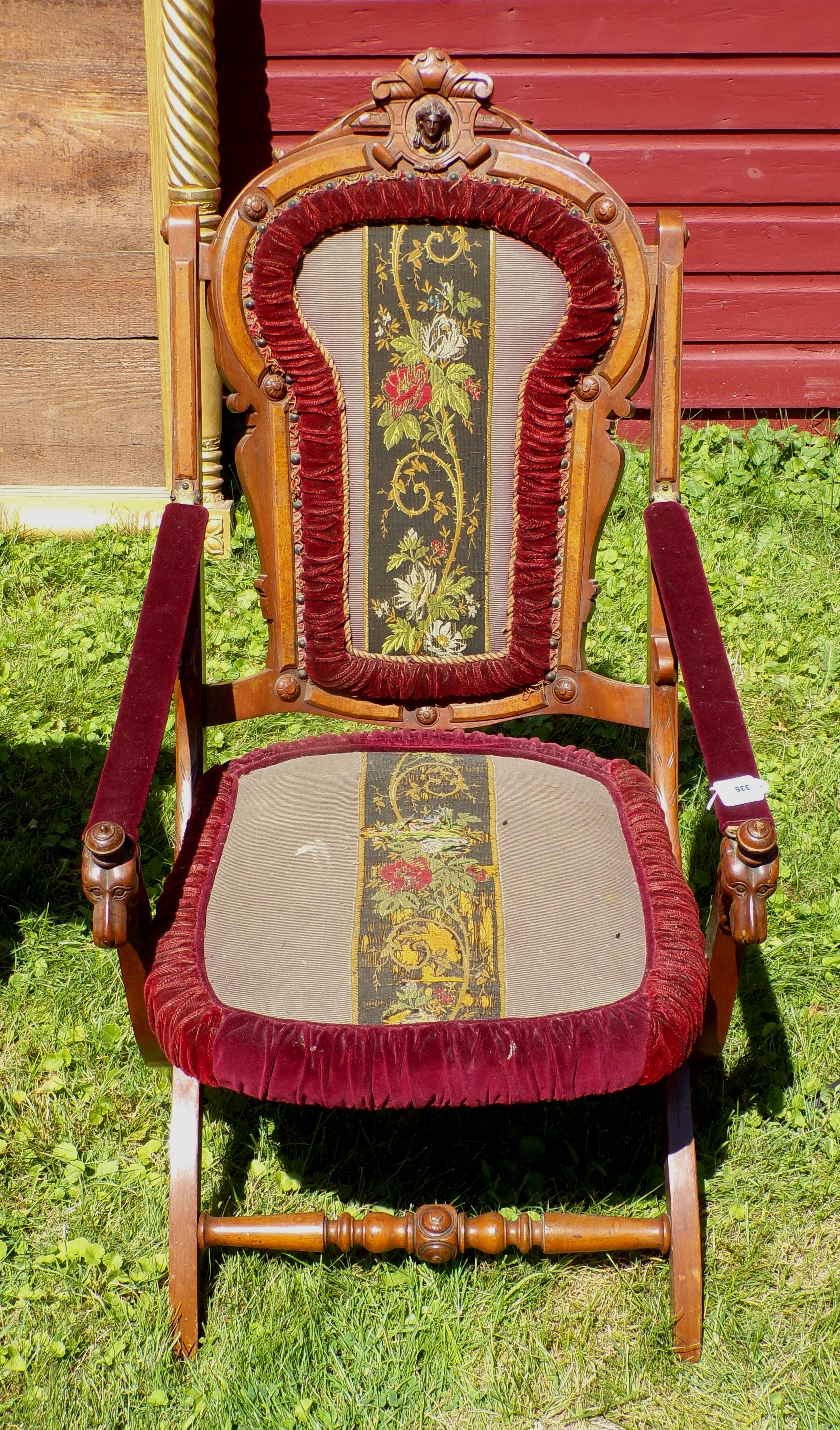 Appraisal: Victorian chair with needlepoint upholstery carved dog heads on arms