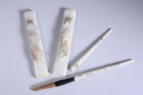 Appraisal: TWO CHINESE WHITE JADE PAPER WEIGHTS AND TWO BRUSHES Qianlong