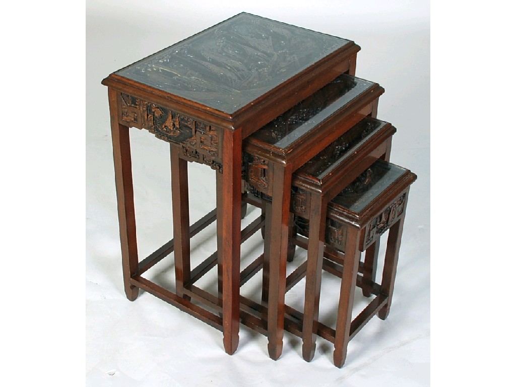 Appraisal: NEST OF FOUR CHINESE CARVED HARDWOOD OCCASIONAL TABLES the oblong