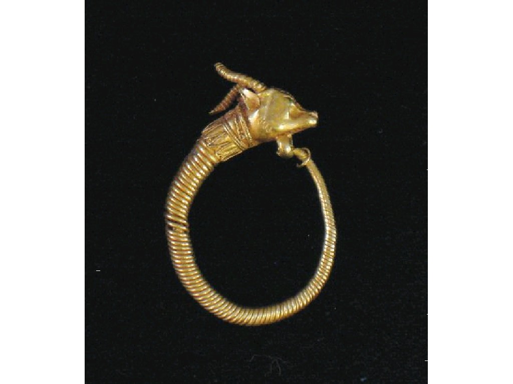 Appraisal: AN ANCIENT EGYPTIAN GOLD EARRING of coiled form with a