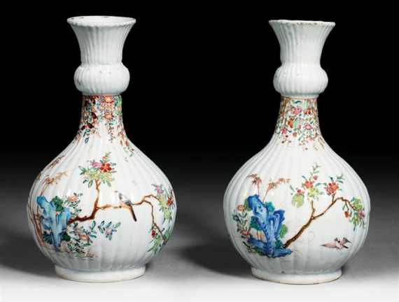 Appraisal: A PAIR OF RIBBED VASES WITH FAMILLE ROSE DESIGN OF