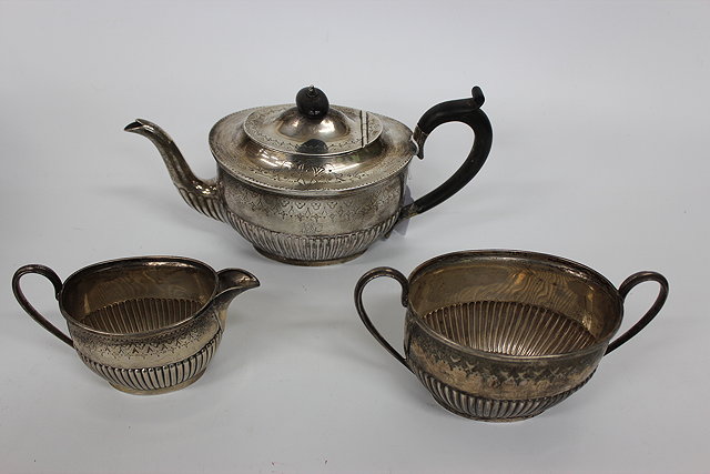 Appraisal: A VICTORIAN SILVER THREE PIECE TEA SET the oval teapot