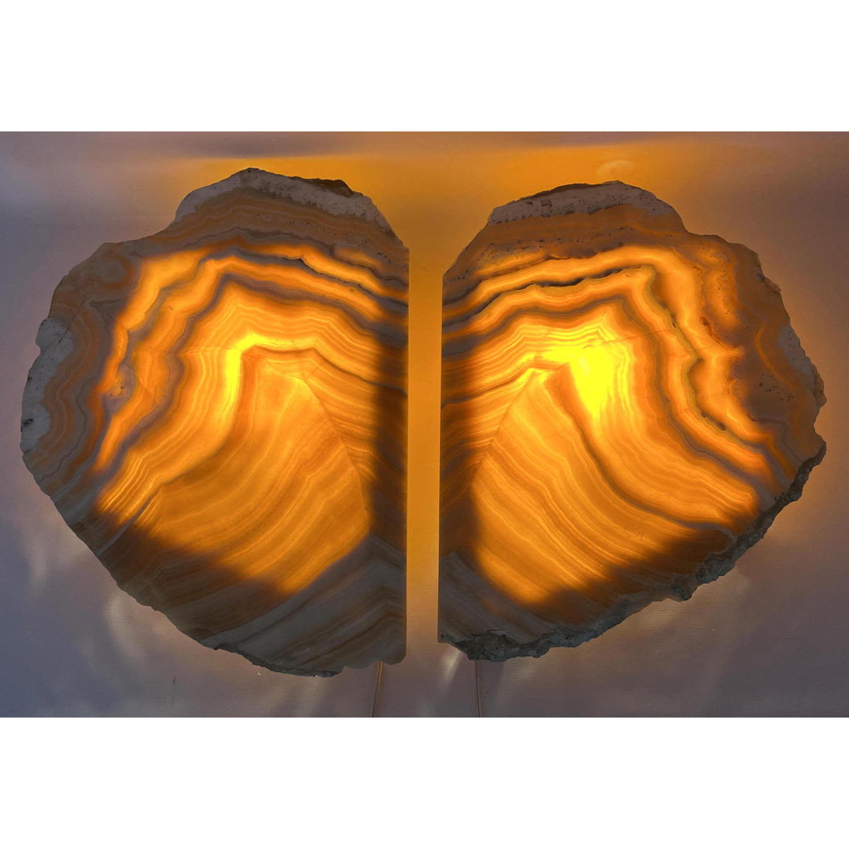 Appraisal: Pr Natural Agate slice wall sconces Backlit to reveal stones