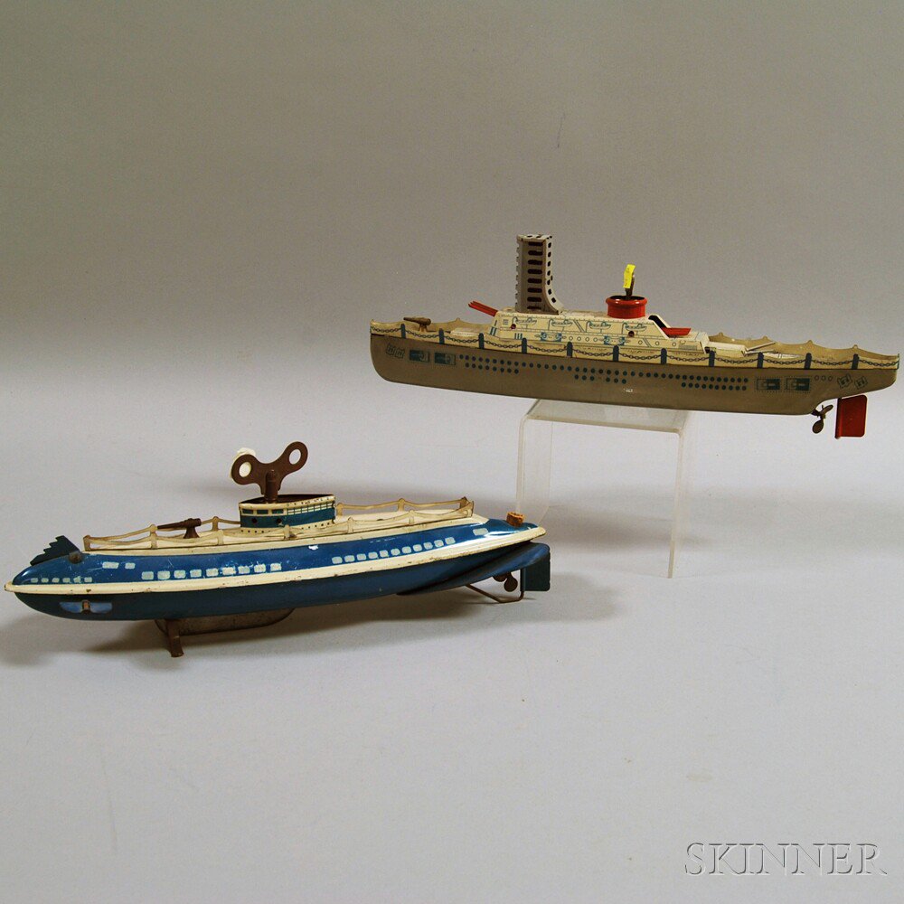 Appraisal: Two Vintage Wolverine Tin Lithographed Wind-up Boat Toys c s