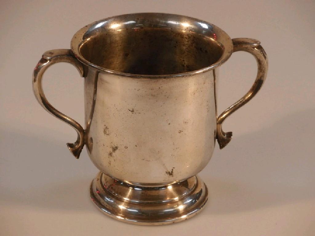 Appraisal: A silver plated two-handled cup by Walker Hall with query