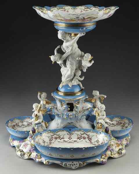 Appraisal: Sevres style porcelain centerpiece with plates the central charger held