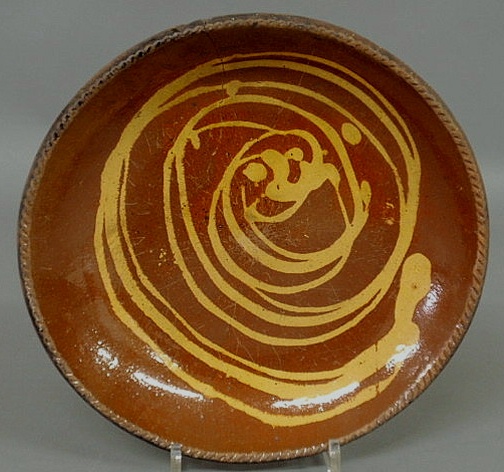 Appraisal: Pennsylvania redware pie plate th c with slip decoration dia