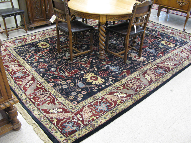 Appraisal: HAND KNOTTED ORIENTAL CARPET Indo-Persian overall floral decoration on rectangular