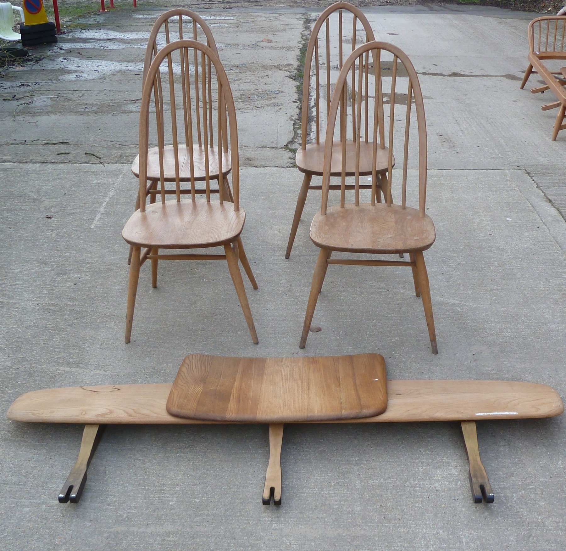 Appraisal: Four Ercol stick back chairs a settee back board and