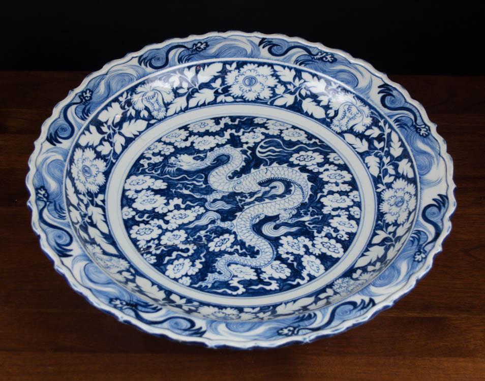 Appraisal: CHINESE QING BLUE AND WHITE CHARGER with dragon motif and