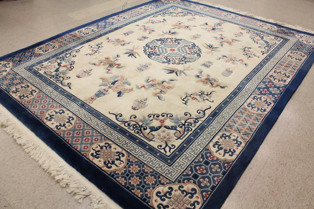 Appraisal: HAND KNOTTED CHINESE CARPET traditional sculpted Peking design on ivory