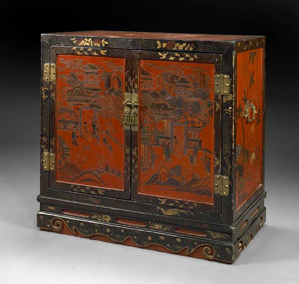 Appraisal: A black and red lacquered wood two-door cabinet Early th