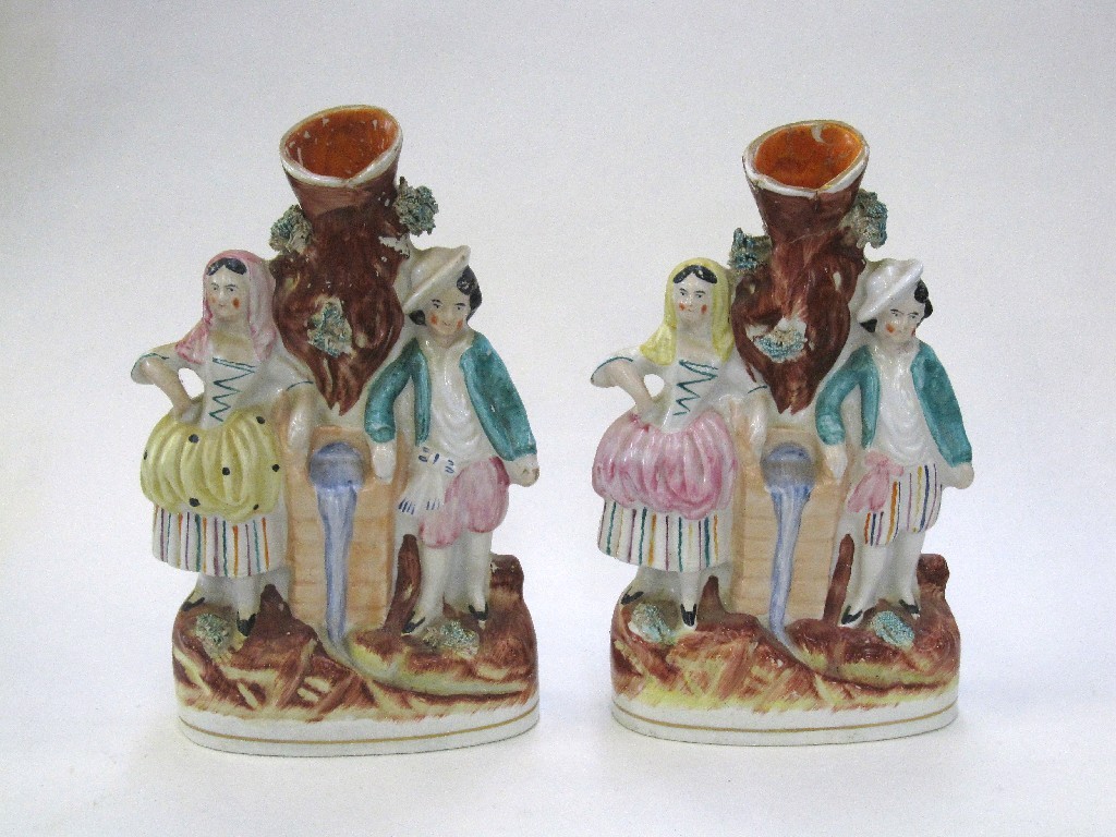 Appraisal: Pair of Staffordshire spill vases modelled as a couple standing