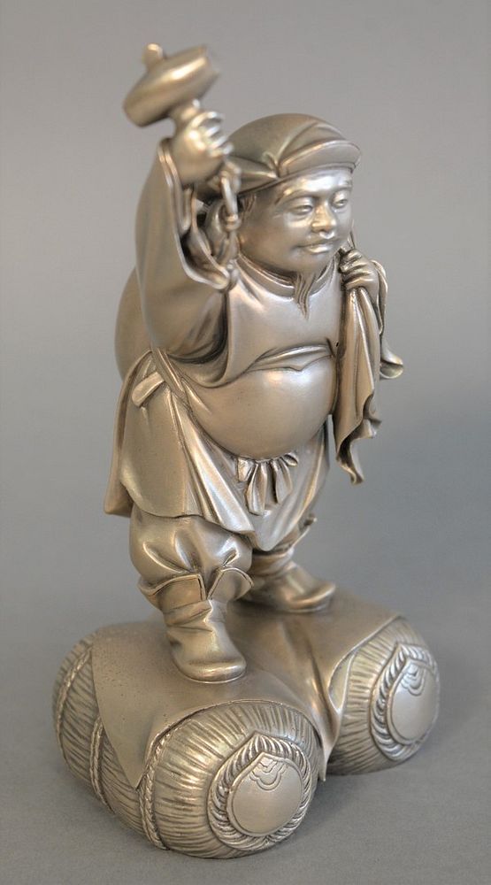 Appraisal: Large Japanese Meiji solid silver figure holding a hammer ht