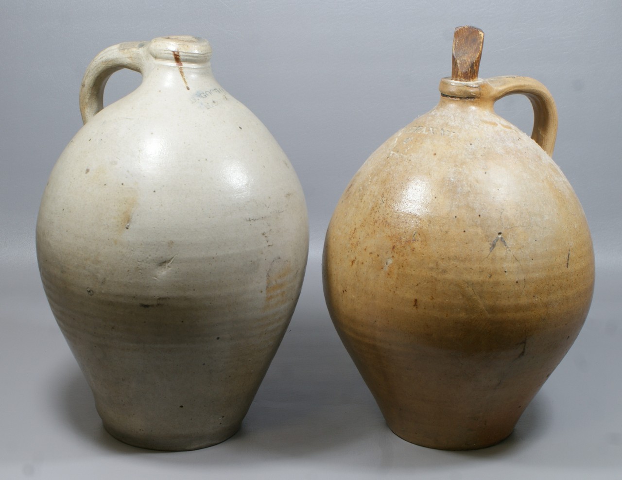 Appraisal: ovoid NE stoneware jugs D Goodall Hartford tall glaze pops