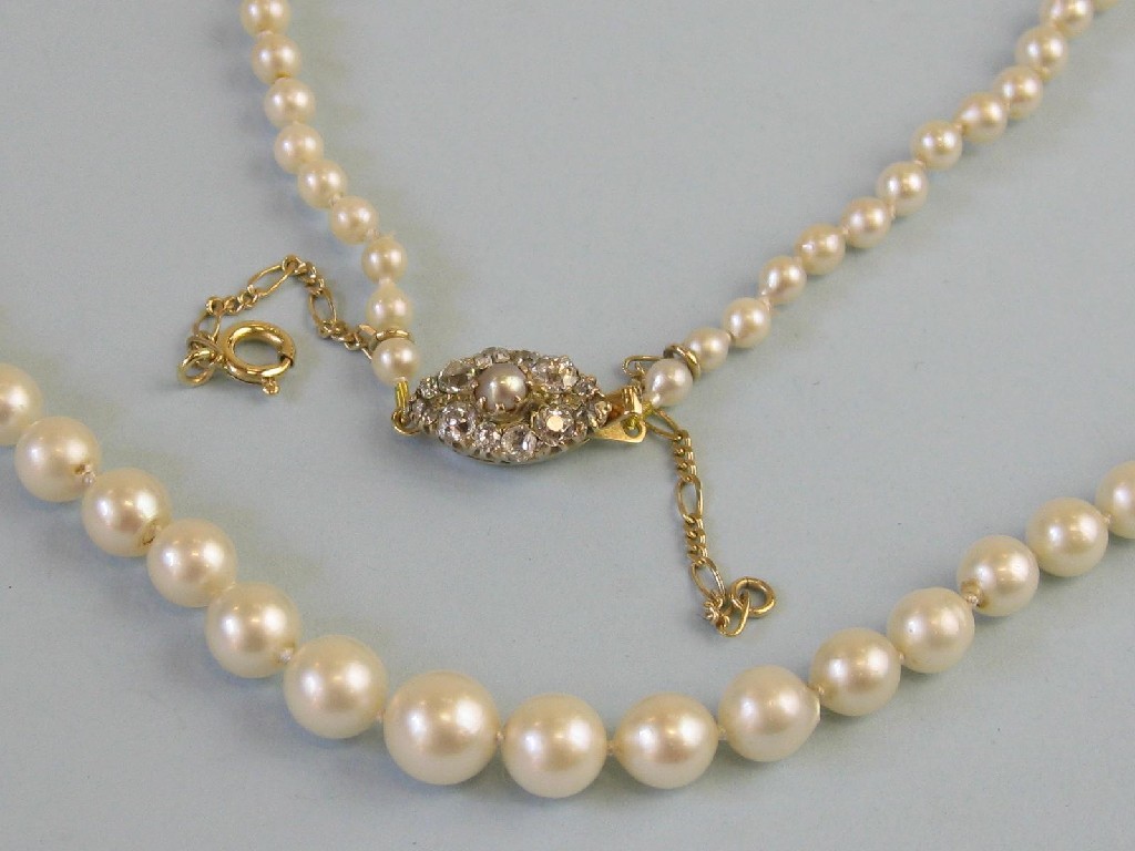 Appraisal: A single row of graduated Pearls the lozenge shaped clasp