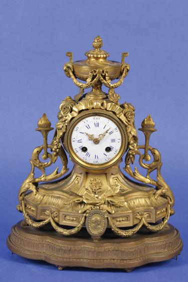 Appraisal: A VICTORIAN GILT METAL MANTLE CLOCK the circular enamel dial