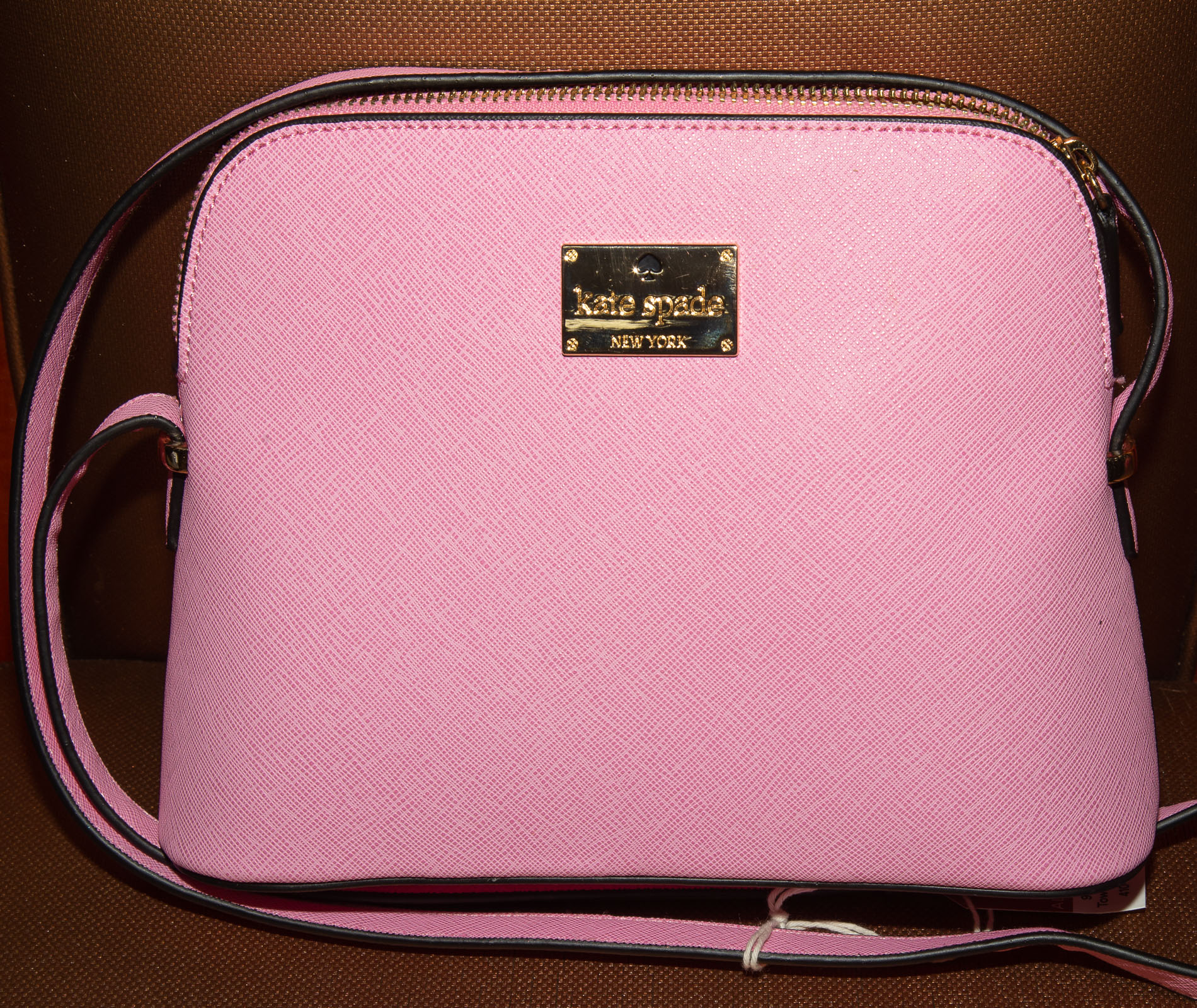 Appraisal: A PINK KATE SPADE HANDBAG A pink leather Kate Spade