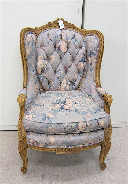 Appraisal: LOUIS XV STYLE CARVED AND UPHOLSTERED WINGBACK ARMCHAIR the carved