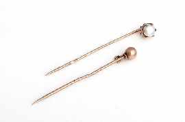 Appraisal: Two ct gold pins one set with a cultured pearl