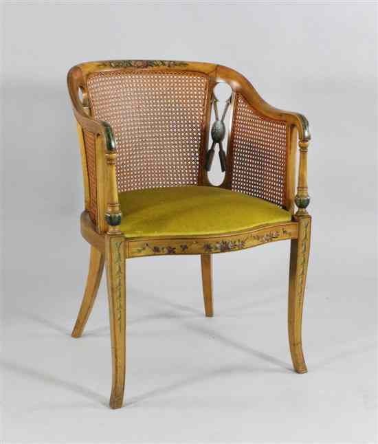 Appraisal: An Edwardian painted satin birch bergere tub chair on splayed