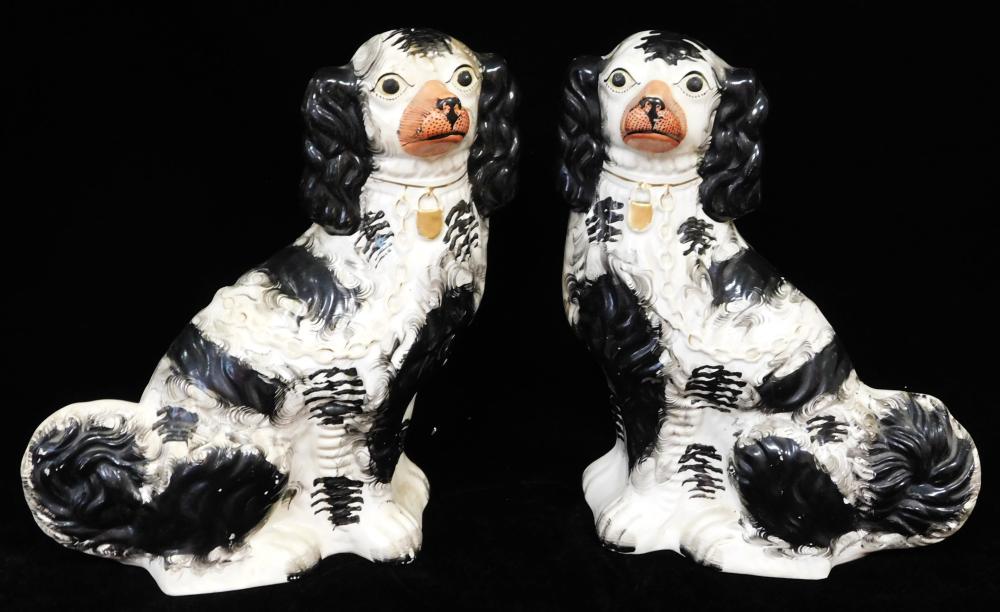 Appraisal: Pair of Staffordshire pottery figures of dogs spaniel form painted