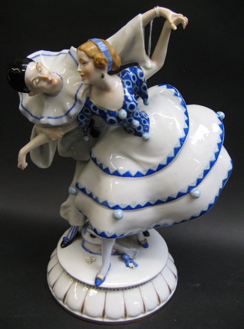 Appraisal: AUSTRIAN PORCELAIN FIGURAL GROUP depicting a Harlequin costumed man and