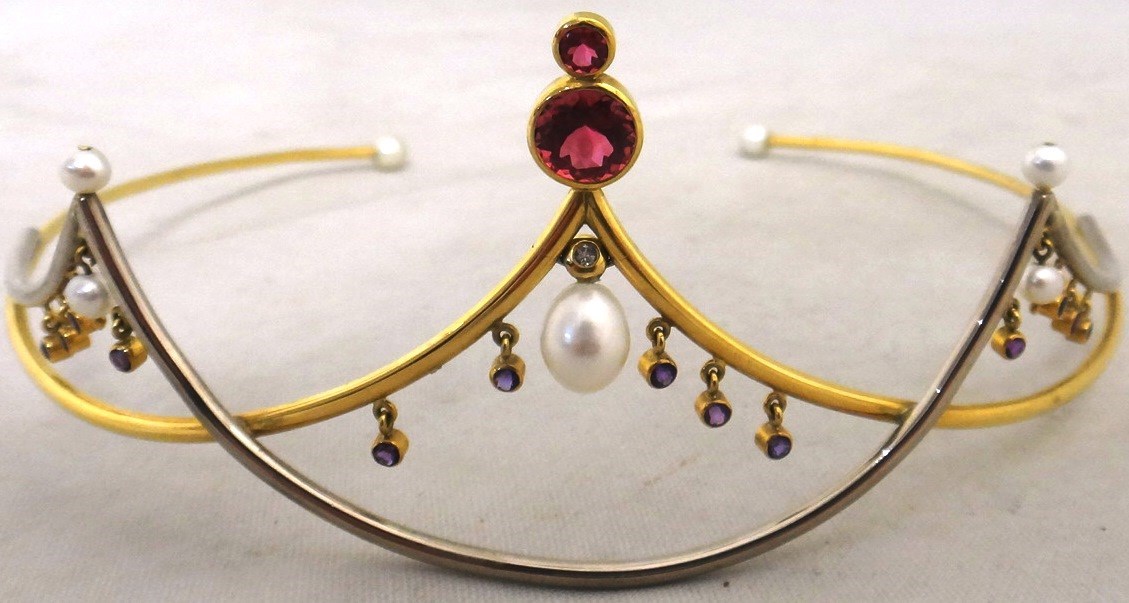 Appraisal: A gold and silver and gem set tiara the front