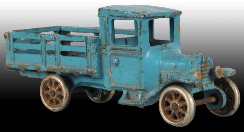 Appraisal: Cast Iron Arcade Model T Stakeback Truck Description Nickel wheels