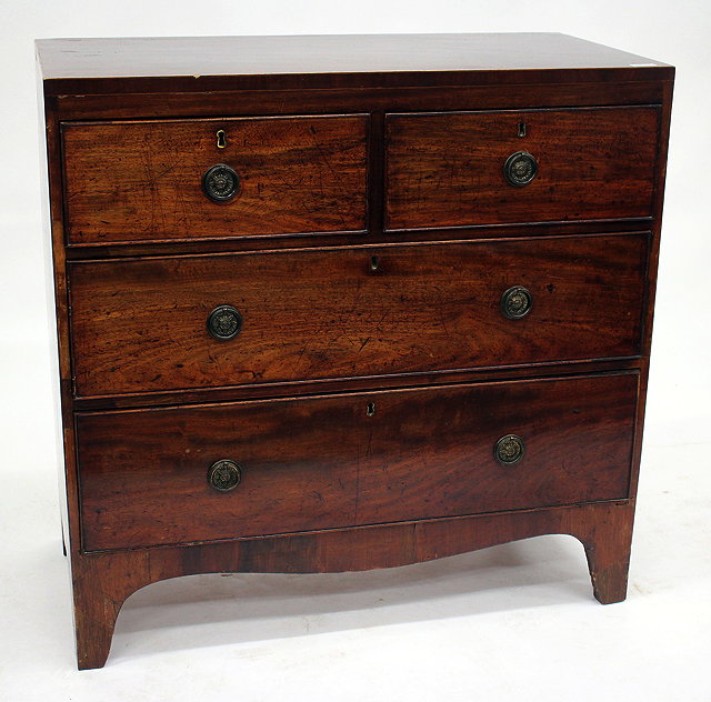 Appraisal: A LATE GEORGIAN MAHOGANY STRAIGHT FRONT CHEST of two short