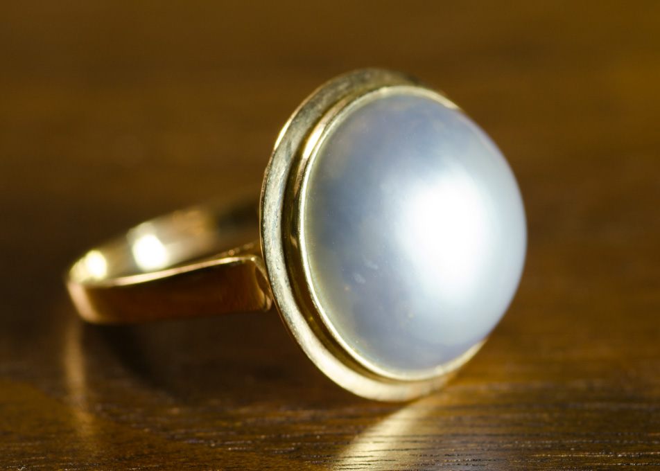 Appraisal: MABE' PEARL AND FOURTEEN KARAT GOLD RING with a dark