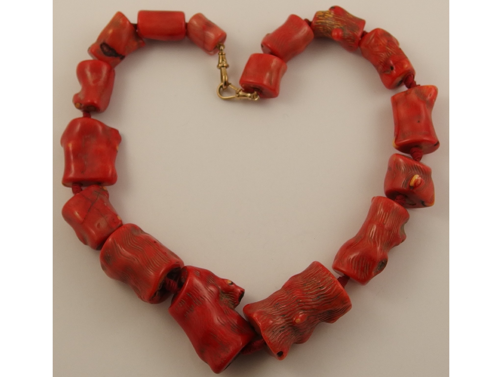 Appraisal: A dyed red chunky coral statement necklacethe beads are roughly