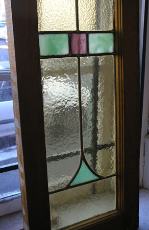 Appraisal: PAIR AMERICAN STAINED AND LEADED GLASS WINDOWS in original wood