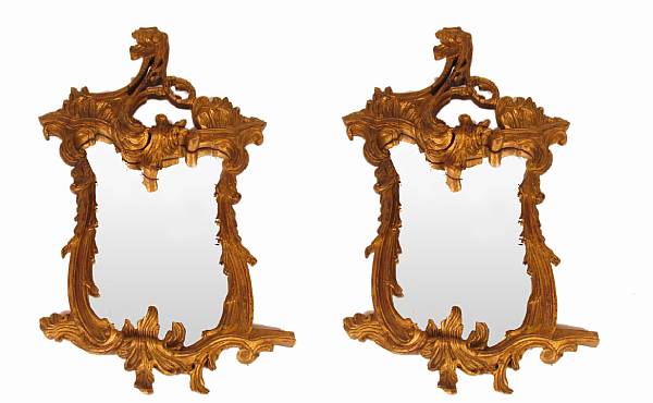 Appraisal: A pair of Italian Rococo style carved giltwood mirrors height