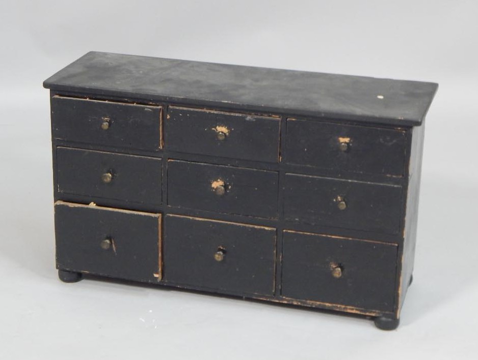 Appraisal: A bank of six Victorian black painted pine drawers on