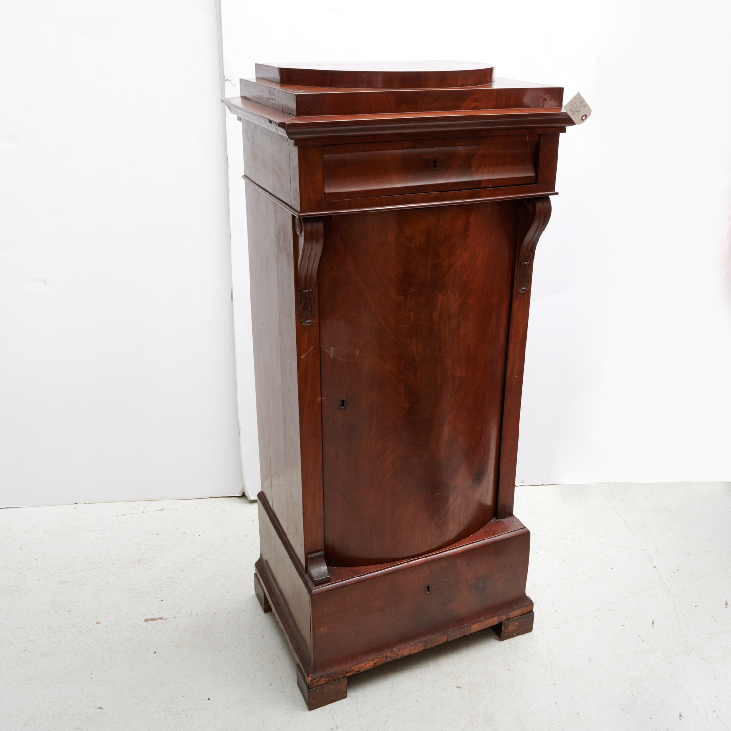 Appraisal: CONTINENTAL MAHOGANY PEDESTAL CABINET th th c with bow front