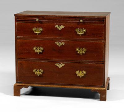 Appraisal: Georgian mahogany bachelor's chest figured mahogany three dovetailed drawers with